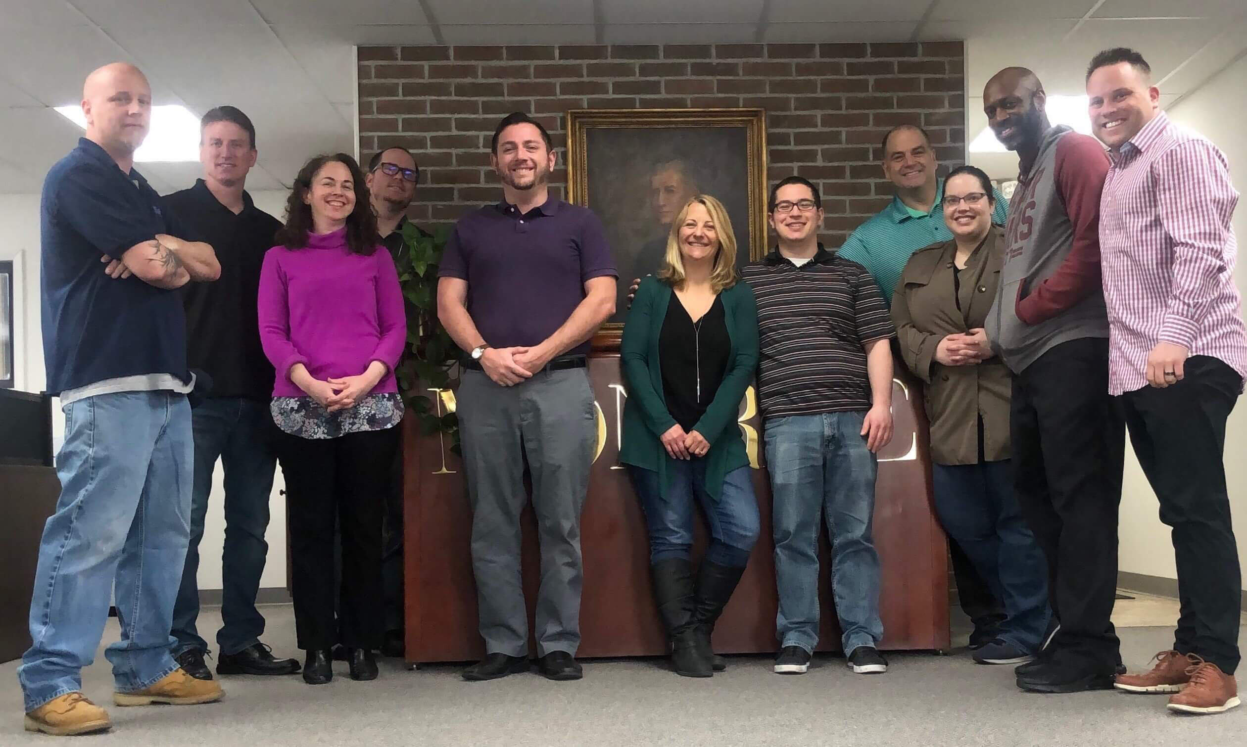 The staff at Monroe pose with Mary McGrogan